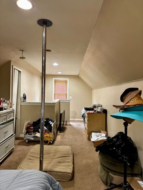 carpeted bedroom with lofted ceiling
