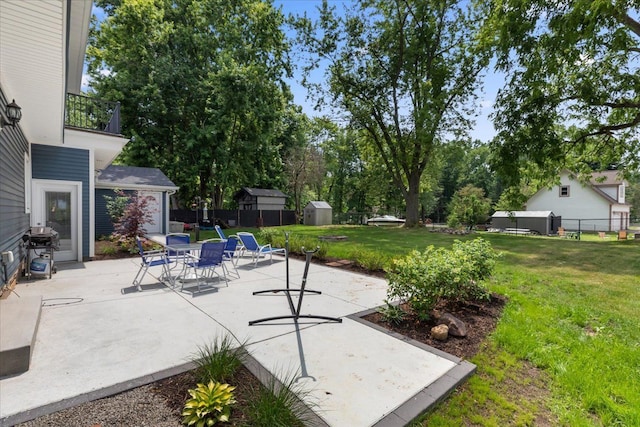 114 Bernstadt St, Novi, MI 48377 - view of patio with an outdoor structure, fence, a shed, and a grill