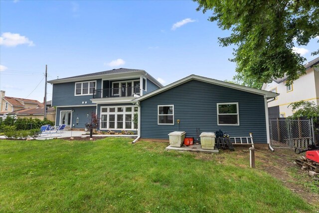 114 Bernstadt St, Novi, MI 48377 - rear view of house with a lawn, fence, a balcony, and a patio area
