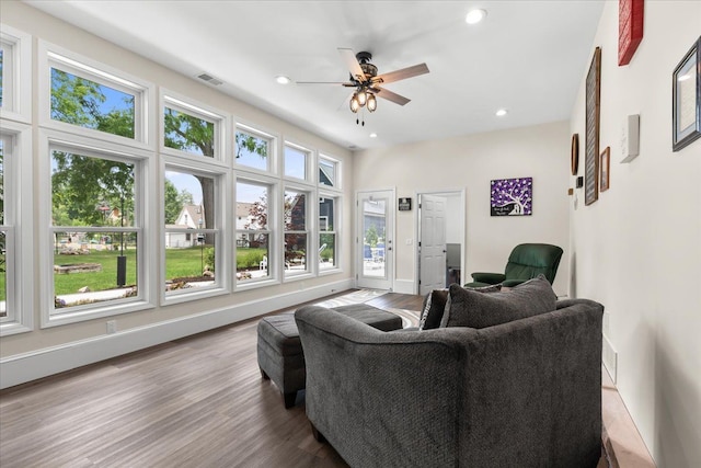 114 Bernstadt St, Novi, MI 48377 - living area with visible vents, a ceiling fan, wood finished floors, and a wealth of natural light