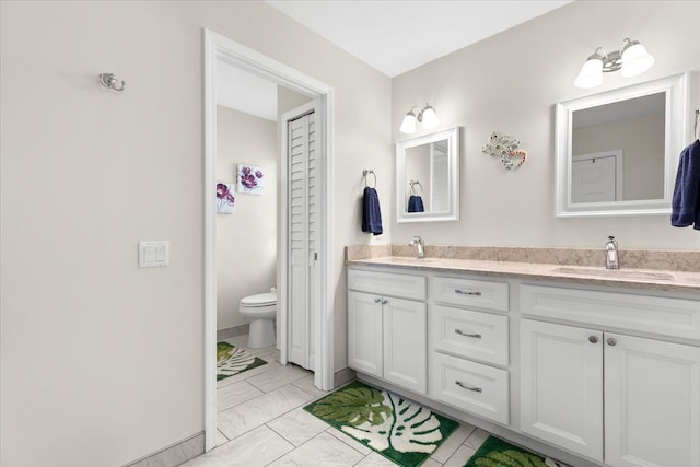 114 Bernstadt St, Novi, MI 48377 - bathroom with double vanity, toilet, a sink, and marble finish floor