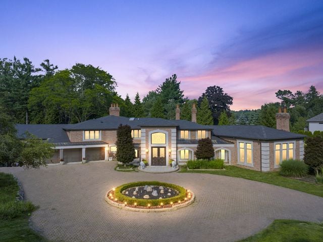 362 Keswick Rd, Bloomfield Hills, MI 48304 - view of front of house with curved driveway and a chimney