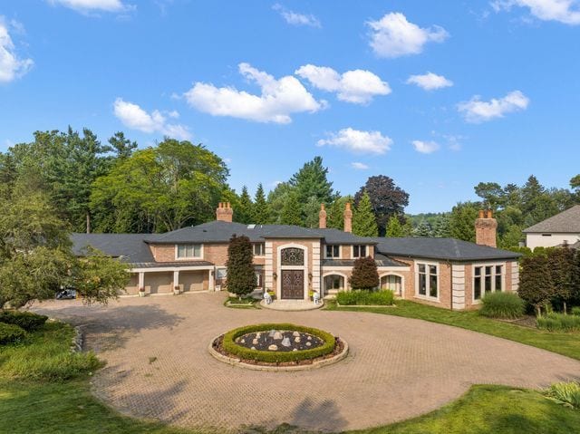 362 Keswick Rd, Bloomfield Hills, MI 48304 - view of front facade with curved driveway and a chimney
