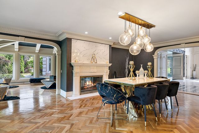 362 Keswick Rd, Bloomfield Hills, MI 48304 - dining area featuring crown molding, recessed lighting, a high end fireplace, ornate columns, and arched walkways