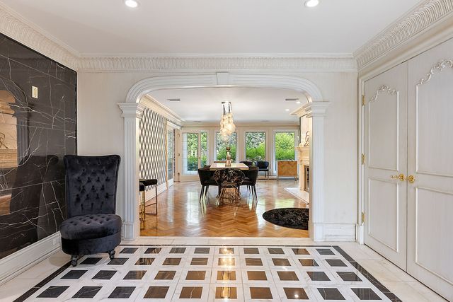 362 Keswick Rd, Bloomfield Hills, MI 48304 - entrance foyer featuring crown molding, arched walkways, and decorative columns