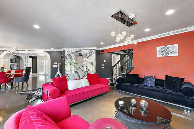 362 Keswick Rd, Bloomfield Hills, MI 48304 - living room featuring arched walkways, ornamental molding, recessed lighting, and stairs