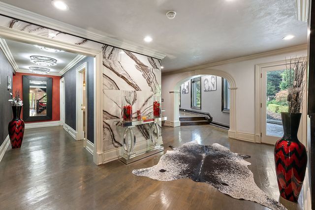 362 Keswick Rd, Bloomfield Hills, MI 48304 - interior space with arched walkways, baseboards, ornamental molding, and plenty of natural light