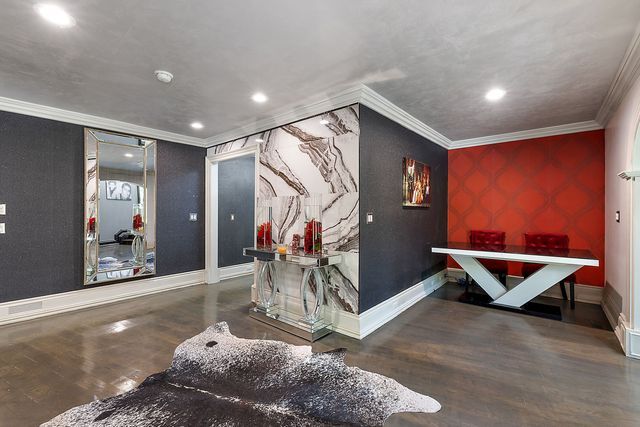 362 Keswick Rd, Bloomfield Hills, MI 48304 - interior space featuring crown molding, baseboards, wood finished floors, and wallpapered walls