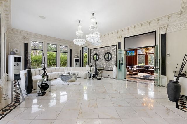 362 Keswick Rd, Bloomfield Hills, MI 48304 - interior space with an inviting chandelier and marble finish floor