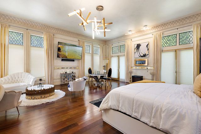 362 Keswick Rd, Bloomfield Hills, MI 48304 - bedroom with an inviting chandelier and wood finished floors