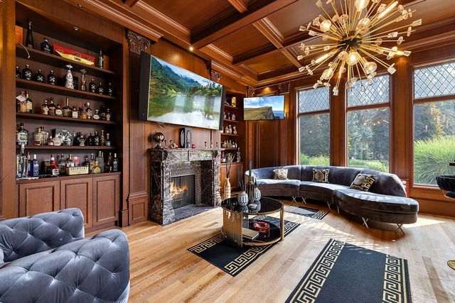 362 Keswick Rd, Bloomfield Hills, MI 48304 - living room featuring crown molding, wood finished floors, wooden ceiling, beamed ceiling, and an inviting chandelier