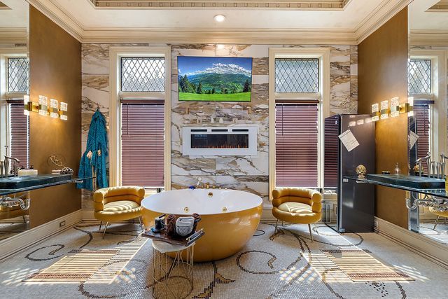 362 Keswick Rd, Bloomfield Hills, MI 48304 - bathroom with a raised ceiling, ornamental molding, and a large fireplace