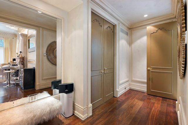 362 Keswick Rd, Bloomfield Hills, MI 48304 - mudroom featuring crown molding, a decorative wall, dark wood finished floors, and visible vents