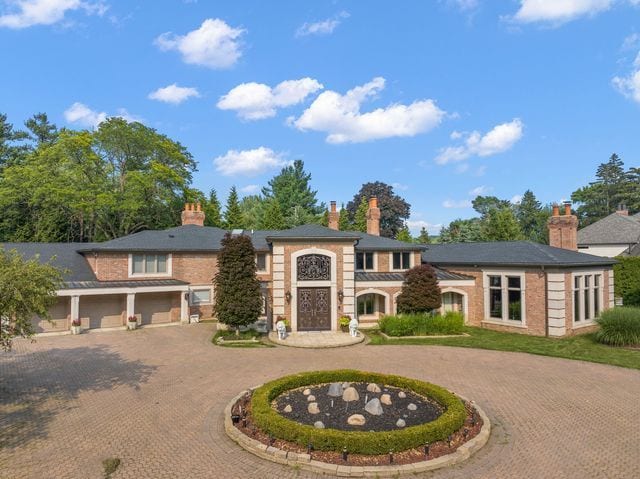 362 Keswick Rd, Bloomfield Hills, MI 48304 - view of front facade with curved driveway and a chimney