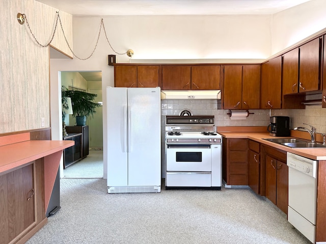 1536 W 13 Mile Rd, Madison Heights, MI 48071 - kitchen featuring backsplash, a sink, light countertops, under cabinet range hood, and white appliances