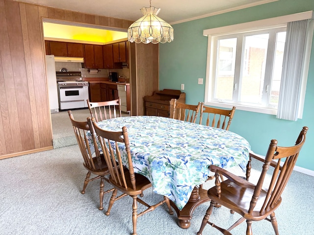 1536 W 13 Mile Rd, Madison Heights, MI 48071 - dining area featuring crown molding, baseboards, a chandelier, and light colored carpet