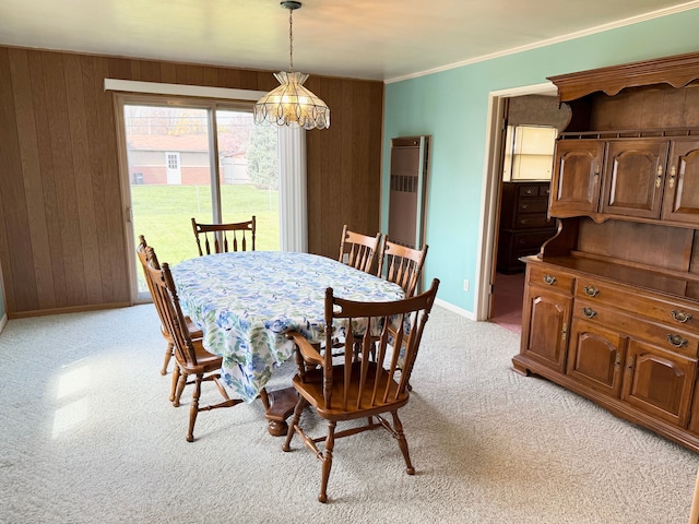 1536 W 13 Mile Rd, Madison Heights, MI 48071 - dining area featuring crown molding, light carpet, baseboards, wooden walls, and a notable chandelier