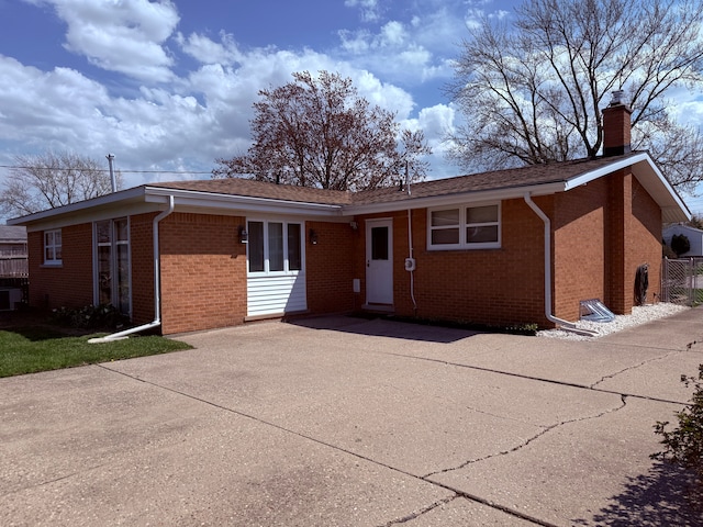1536 W 13 Mile Rd, Madison Heights, MI 48071 - single story home with brick siding, driveway, and a chimney
