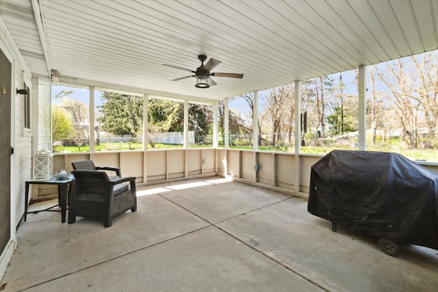 view of patio / terrace with fence, a ceiling fan, and grilling area