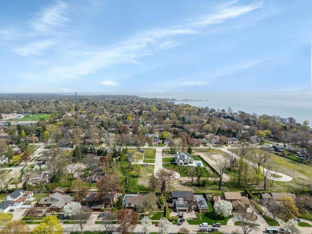 birds eye view of property with a water view and a residential view