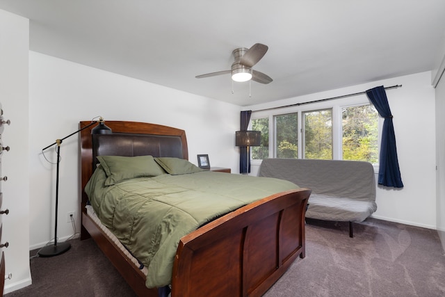 bedroom featuring carpet floors, baseboards, and a ceiling fan