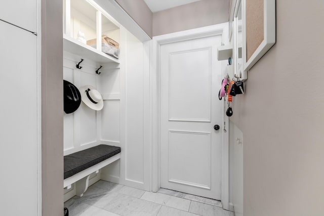 mudroom with marble finish floor