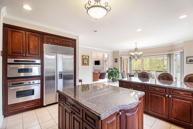 2832 Croftshire Ct, Rochester, MI 48306 - kitchen with ornamental molding, light tile patterned flooring, a kitchen island, a chandelier, and appliances with stainless steel finishes