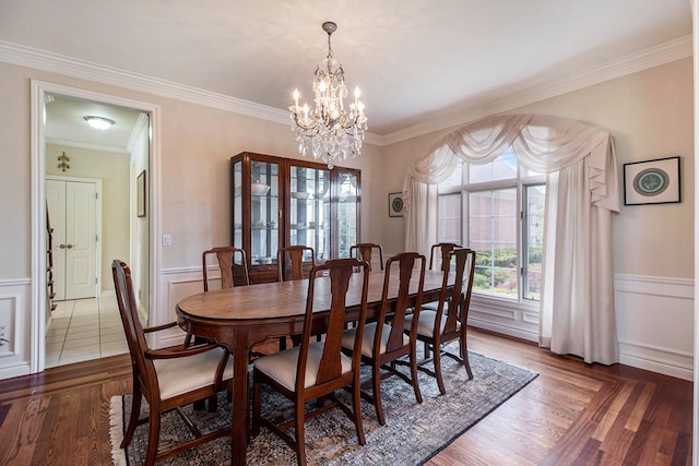2832 Croftshire Ct, Rochester, MI 48306 - dining area with an inviting chandelier, wainscoting, crown molding, and wood finished floors