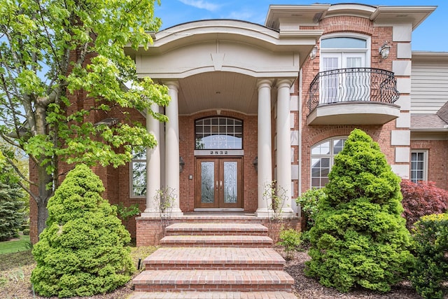 2832 Croftshire Ct, Rochester, MI 48306 - property entrance with brick siding, french doors, and a balcony