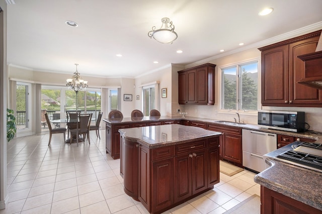 2832 Croftshire Ct, Rochester, MI 48306 - kitchen featuring a sink, light tile patterned floors, a notable chandelier, hanging light fixtures, and stainless steel appliances