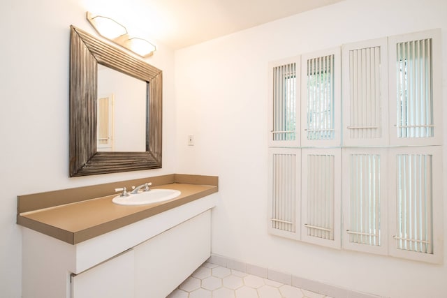 bathroom with tile patterned flooring and vanity
