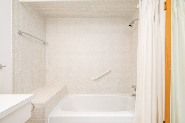 bathroom with shower / bath combo and vanity