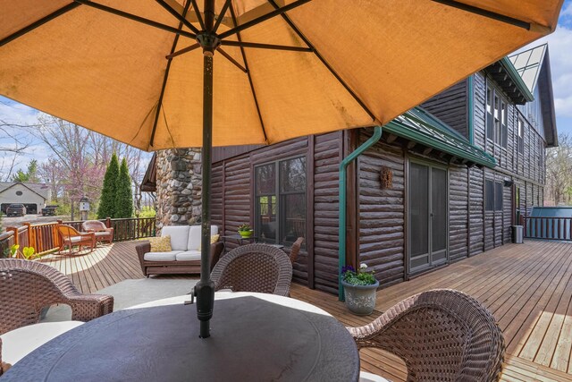 deck with outdoor dining area and an outdoor living space