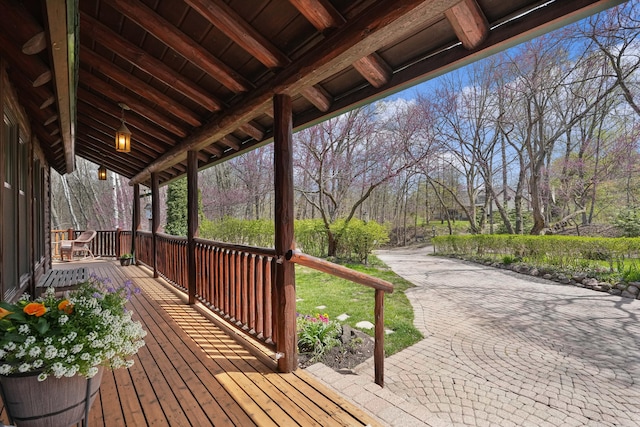wooden terrace with a porch
