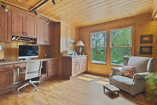 home office featuring wood walls, light wood-style flooring, rail lighting, and wooden ceiling