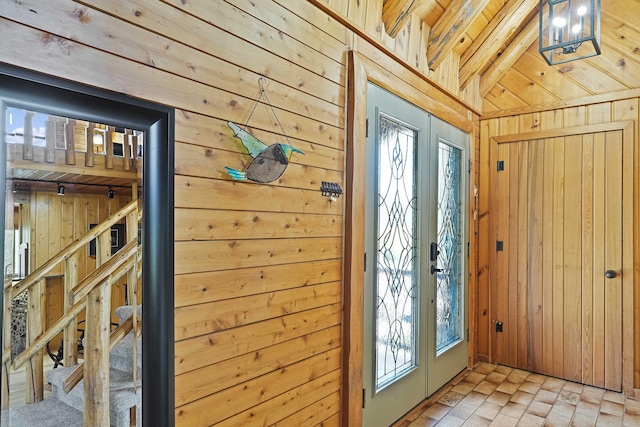 interior space with wooden walls and brick floor