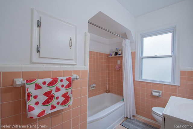 43 Canfield Dr, Mount Clemens, MI 48043 - full bathroom featuring tile walls, toilet, shower / tub combo with curtain, vanity, and a wainscoted wall
