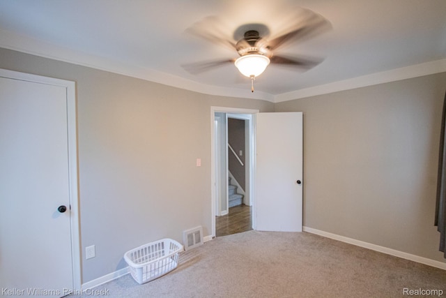 43 Canfield Dr, Mount Clemens, MI 48043 - unfurnished bedroom with carpet flooring, a ceiling fan, and baseboards