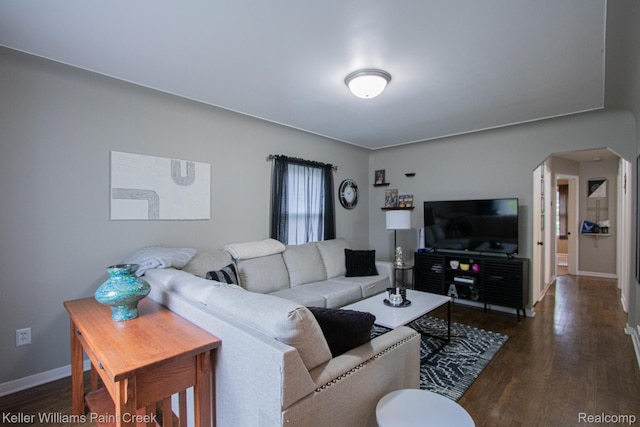 43 Canfield Dr, Mount Clemens, MI 48043 - living area with arched walkways, dark wood-style floors, and baseboards