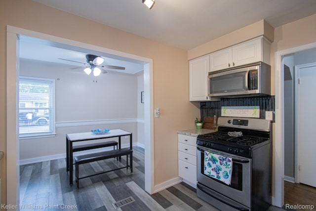 43 Canfield Dr, Mount Clemens, MI 48043 - kitchen featuring appliances with stainless steel finishes, white cabinets, ceiling fan, and dark wood-style flooring