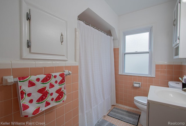 43 Canfield Dr, Mount Clemens, MI 48043 - bathroom featuring tile walls, toilet, vanity, a wainscoted wall, and a shower with curtain