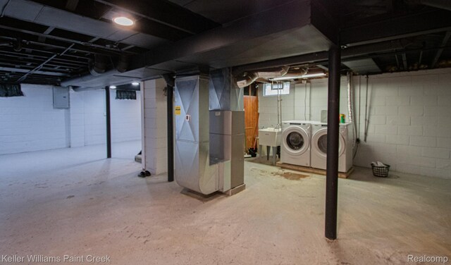 43 Canfield Dr, Mount Clemens, MI 48043 - below grade area featuring washer and dryer, heating unit, a sink, and electric panel