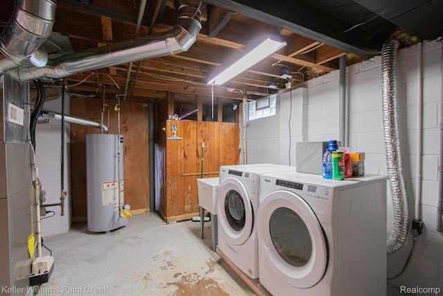 43 Canfield Dr, Mount Clemens, MI 48043 - washroom featuring gas water heater, washing machine and clothes dryer, heating unit, and concrete block wall