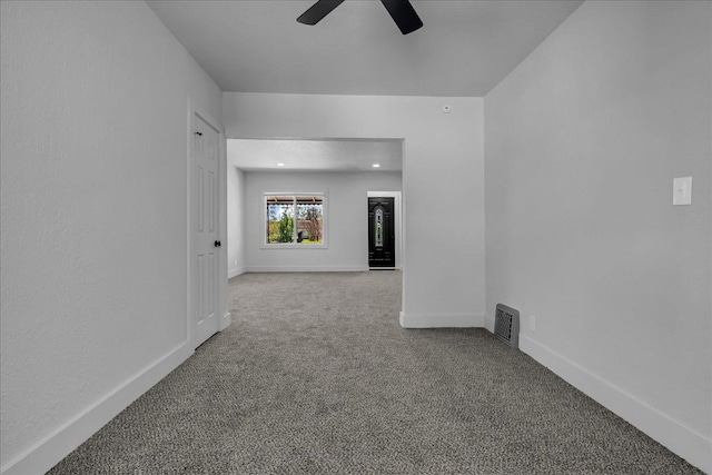 2061 E Whittemore Ave, Burton, MI 48529 - unfurnished room featuring a ceiling fan, baseboards, and carpet