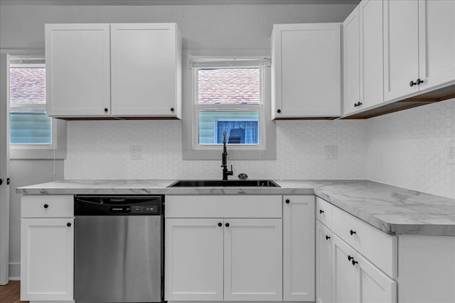 2061 E Whittemore Ave, Burton, MI 48529 - kitchen featuring stainless steel dishwasher, a sink, plenty of natural light, and light countertops