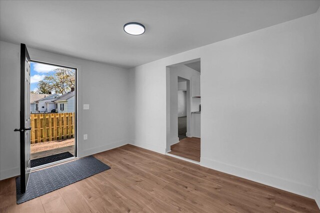 2061 E Whittemore Ave, Burton, MI 48529 - entryway with baseboards and wood finished floors