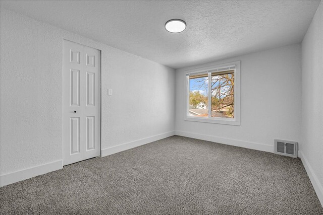 2061 E Whittemore Ave, Burton, MI 48529 - carpeted empty room featuring a textured ceiling and visible vents