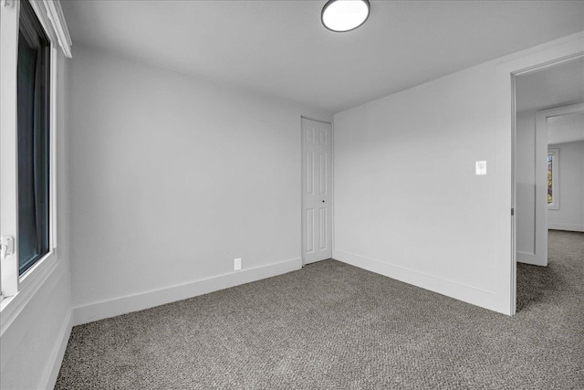 2061 E Whittemore Ave, Burton, MI 48529 - carpeted spare room with baseboards