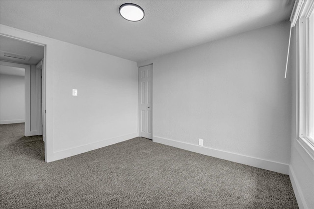 2061 E Whittemore Ave, Burton, MI 48529 - spare room featuring carpet floors and baseboards