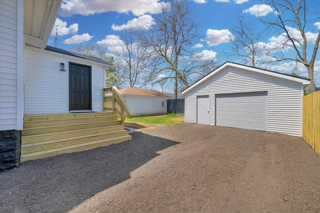2061 E Whittemore Ave, Burton, MI 48529 - detached garage featuring fence and driveway